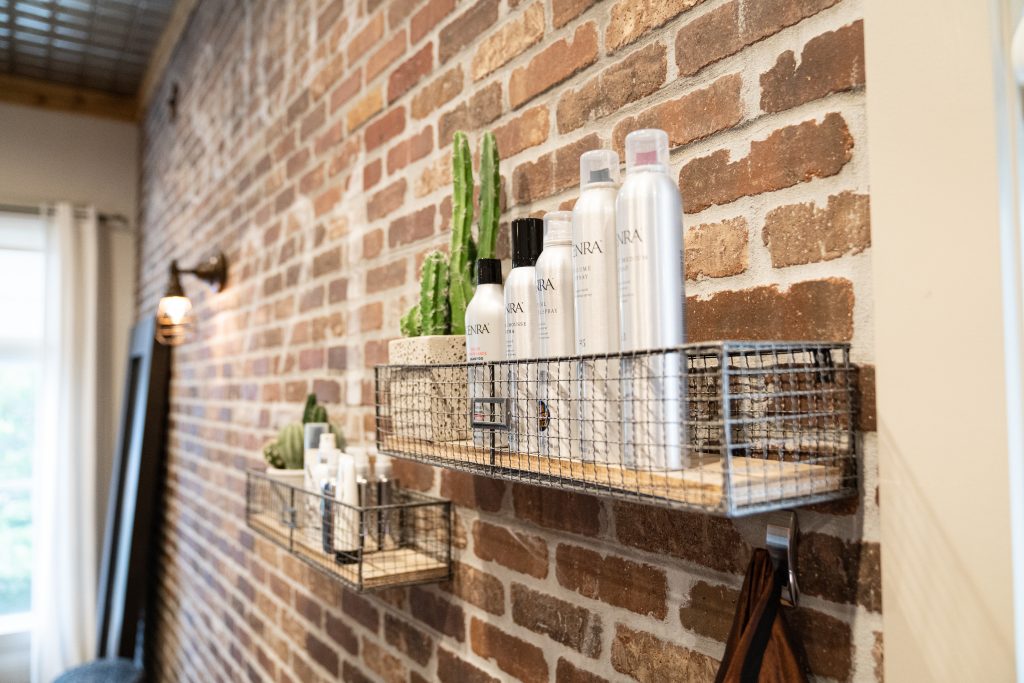 Shampoos and creams displayed on a stand